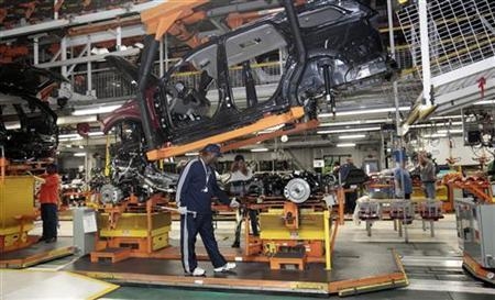 Chrysler auto assembly workers work on the line assembling Jeep Grand Cherokees and Dodge Durangos at the Chrysler Jefferson North Assembly plant in Detroit