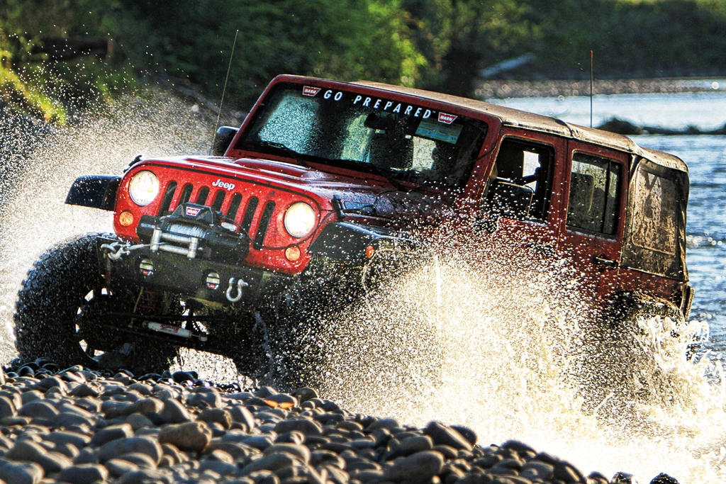 Jeep JK splashing through water